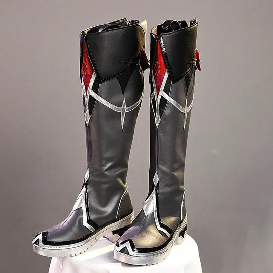 Front view of Durin cosplay boots with tall black shafts, silver straps, red side accents, purple toes, and white soles