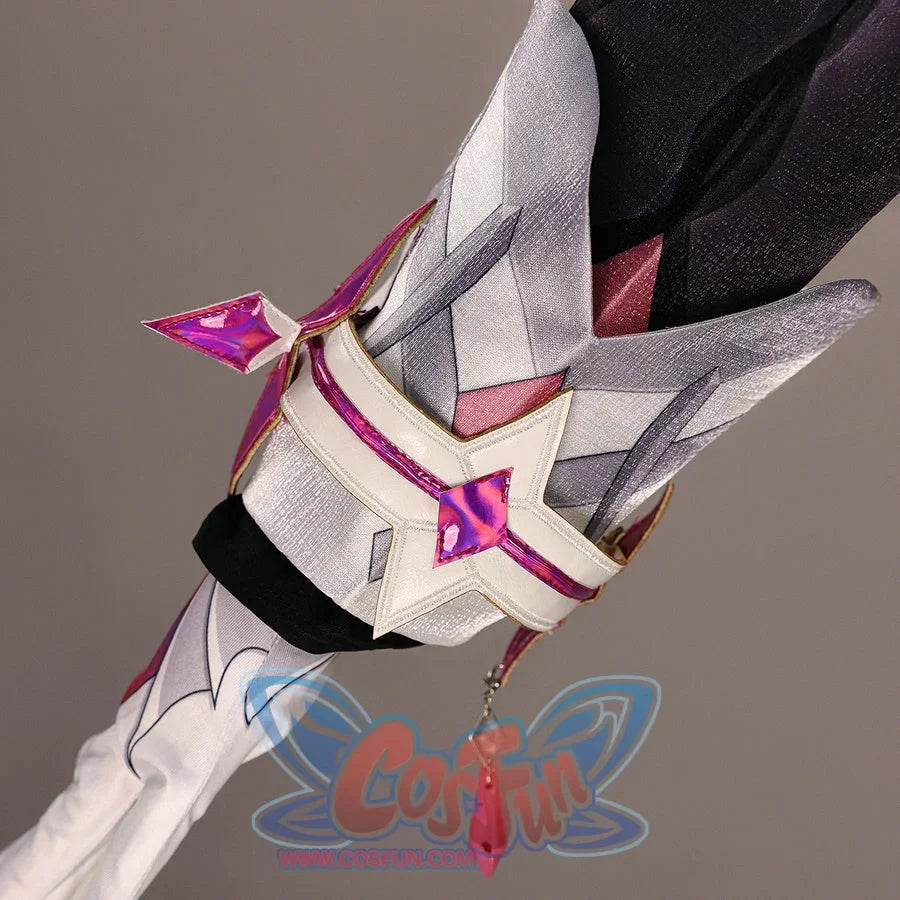 Close-up of Genshin Impact Durin cosplay costume sleeve accessory with white panels, pink star trim, glove, and red tassel