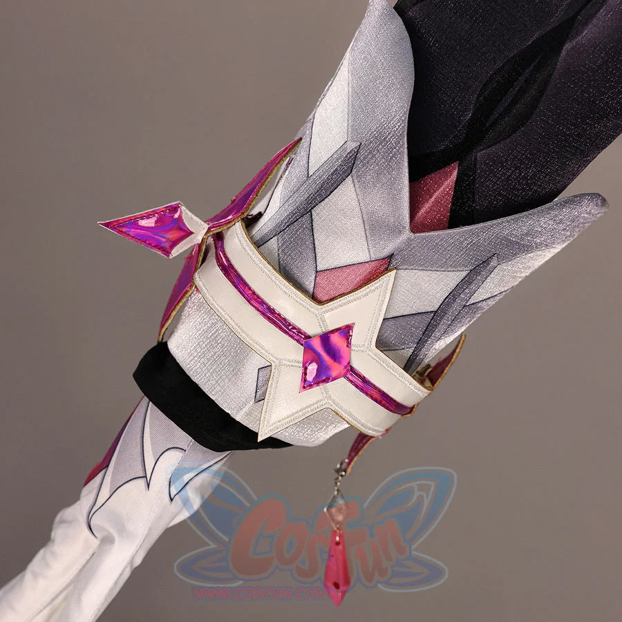 Close-up of Genshin Impact Durin cosplay costume sleeve accessory with white panels, pink star trim, glove, and red tassel