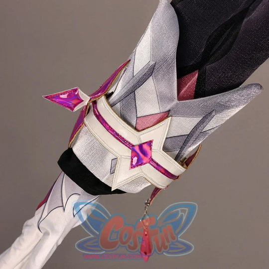 Close-up of Genshin Impact Durin cosplay costume sleeve accessory with white panels, pink star trim, glove, and red tassel