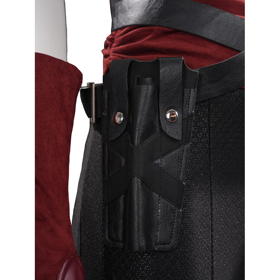 Elektra cosplay costume anchors a black faux leather arm sheath strap against a textured red bodysuit and glove sleeve.