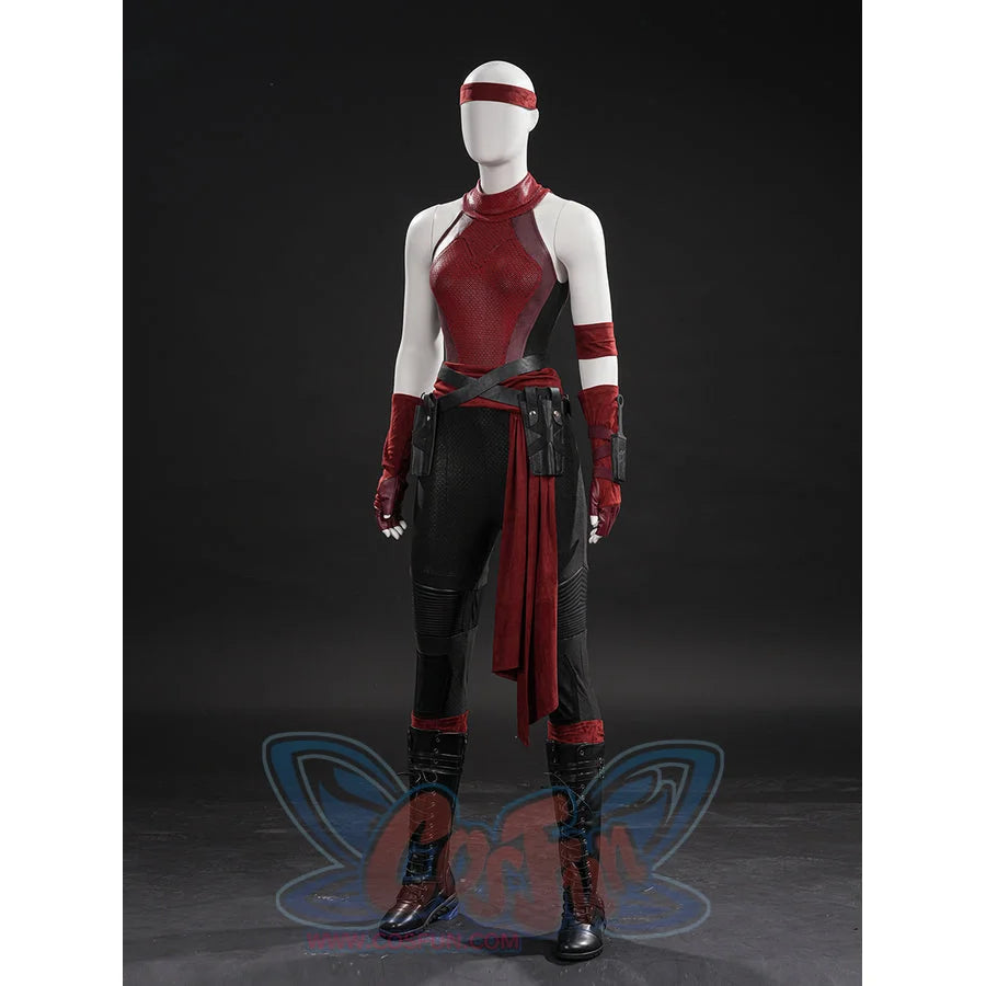 Elektra cosplay costume layers a red bodysuit under a waist sash with faux leather belts and tactical leg guard pieces.