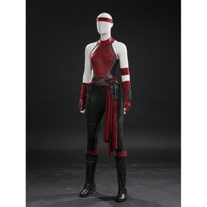 Elektra cosplay costume layers a red bodysuit under a waist sash with faux leather belts and tactical leg guard pieces.