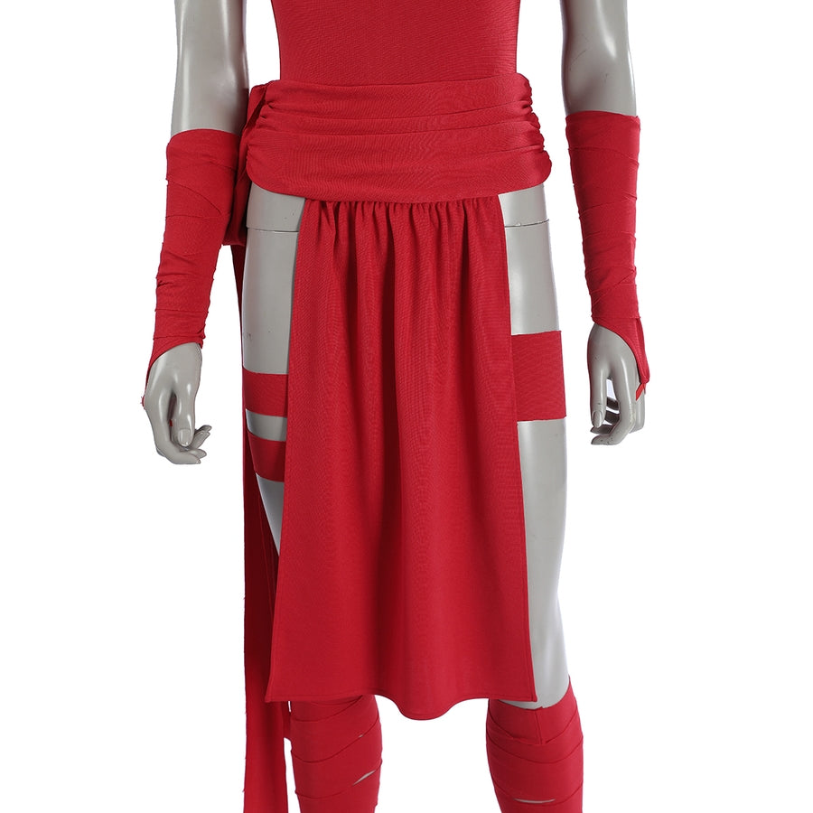 Elektra Natchios cosplay costume layers a red fabric waist wrap over a bodysuit beside matching arm sleeves and leg straps.