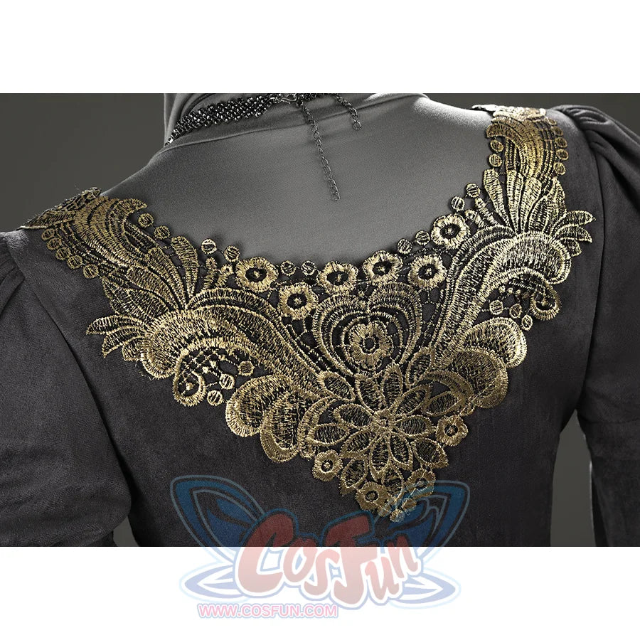 Close-up of the Fire Keeper cosplay upper back showing the intricate gold embroidered trim in detail.
