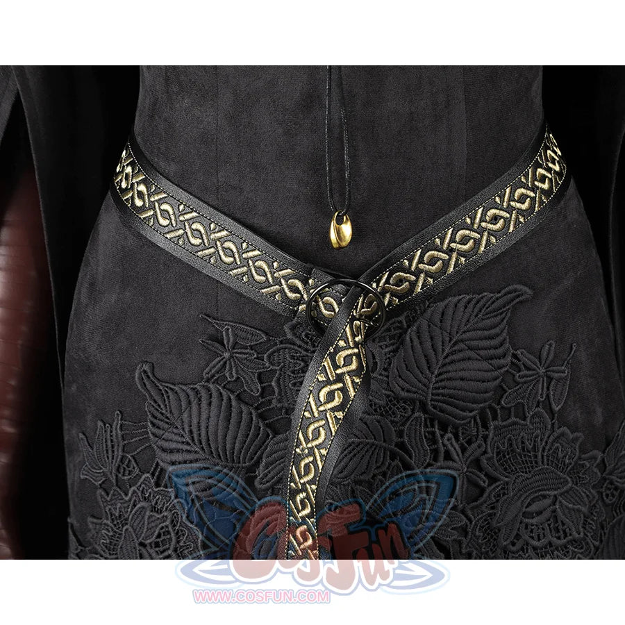 Close-up of the front waist belt on the Dark Souls III Fire Keeper cosplay dress with gold trim and black floral embroidery.