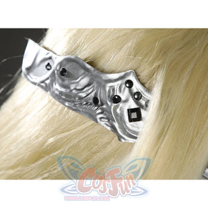 Close-up of the Fire Keeper silver mask side band with sculpted texture and black gem accents over blonde hair.