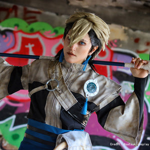 Gachiakuta Zanka Nijiku cosplay costume upper view sets the zip collar beneath blue tassels and shoulder emblem