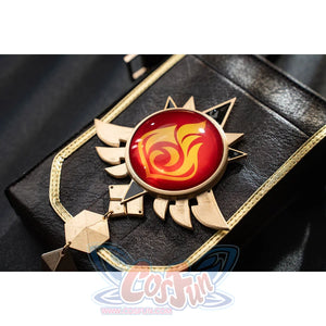 Genshin Impact Bennett cosplay Pyro vision detail anchors a red swirl emblem over black fabric and gold-tone edging
