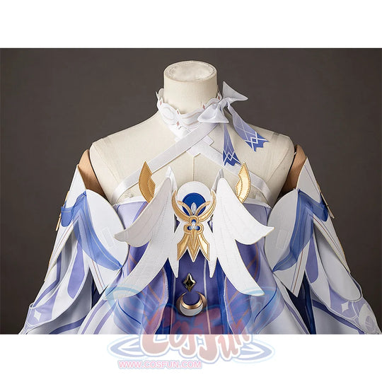Genshin Impact Columbina cosplay bodice frames blue center panels beneath white wing-shaped chest pieces.
