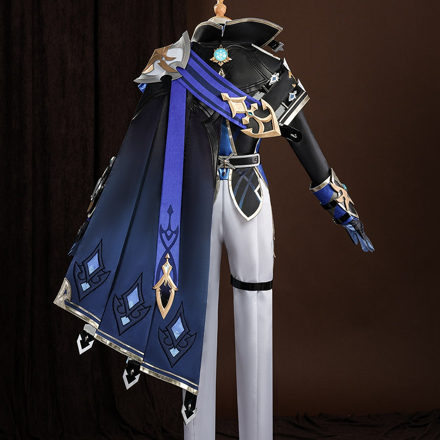 Genshin Impact Lohen cosplay costume layers a structured dark blue cape over fitted white pants and detailed metallic guards.