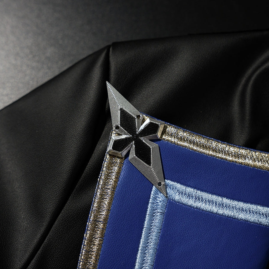 Genshin Impact Lohen cosplay costume layers a metallic star accent over embroidered blue trim and matte black fabric.