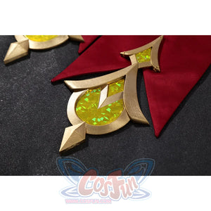 Genshin Impact Sandrone cosplay costume has a gold geometric ornament with yellow facets against red satin.