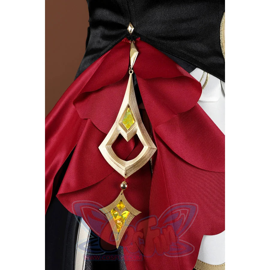 Genshin Impact Sandrone cosplay costume details a gold teardrop dangle with green and yellow gems over red ruffled fabric.