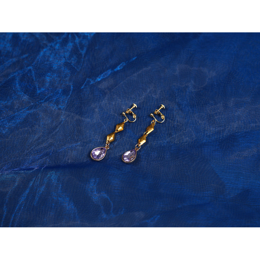 Genshin Impact Snezhnaya Odette cosplay earrings flat lay pairs gold-tone drops with violet accents.