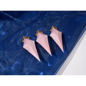 Genshin Impact Snezhnaya Odette cosplay pendant set flat lay lines up three pink drop accessories.