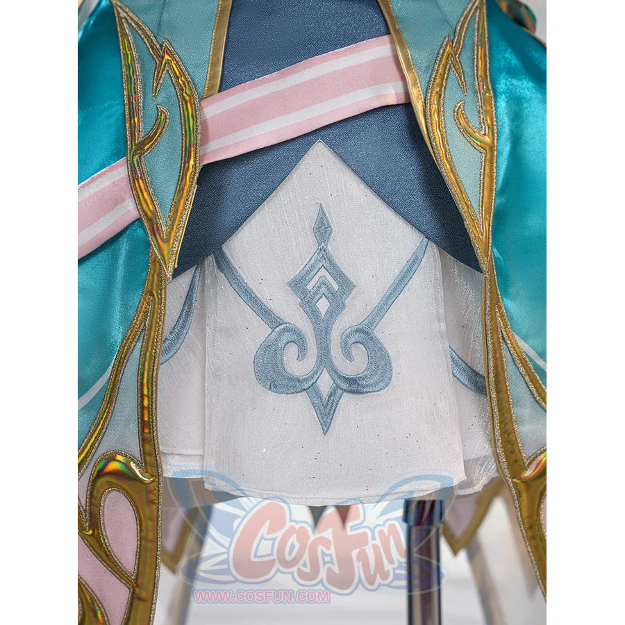 Genshin Impact Vesna cosplay costume skirt detail centers blue embroidery on white fabric below layered trim.