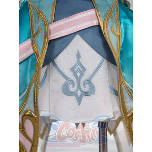 Genshin Impact Vesna cosplay costume skirt detail centers blue embroidery on white fabric below layered trim.