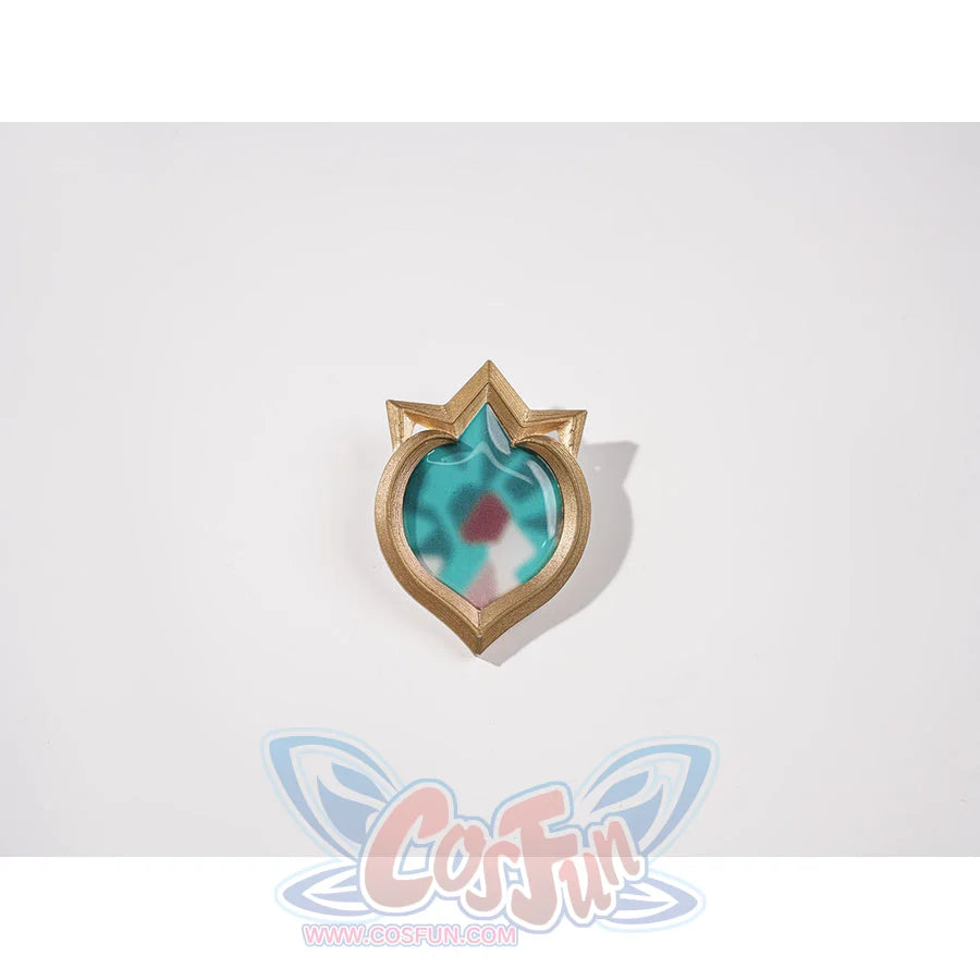 Genshin Impact Vesna cosplay costume Vision ornament centers a turquoise faceted center inside a gold-tone frame.