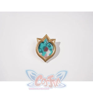 Genshin Impact Vesna cosplay costume Vision ornament centers a turquoise faceted center inside a gold-tone frame.