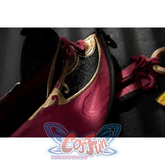 Genshin Impact Yanfei cosplay hat brim close-up layers burgundy fabric over black lining and gold-tone edging.