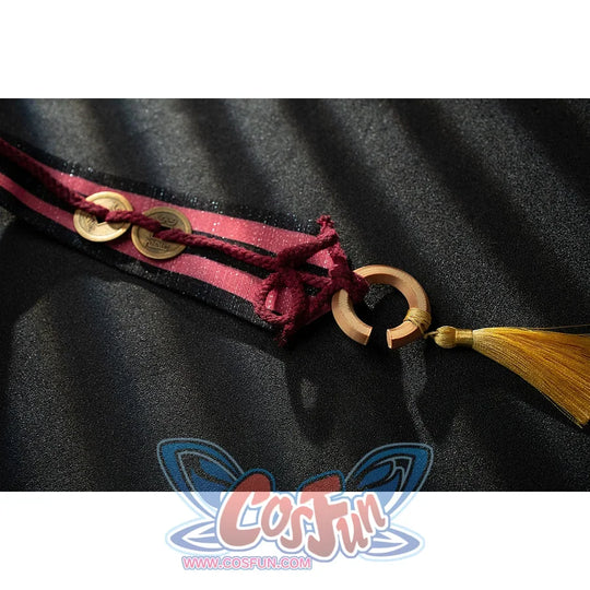 Genshin Impact Yanfei cosplay hat tassel detail ties burgundy cords to a gold-tone moon charm.