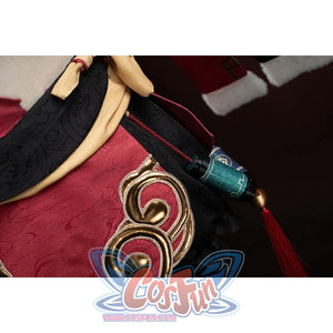 Genshin Impact Yanfei cosplay side waist detail places a teal tassel beside red embroidered trim.