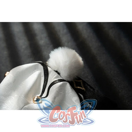 Genshin Impact Yanfei cosplay sleeve pom-pom detail gathers ivory fabric into a fluffy white cuff.
