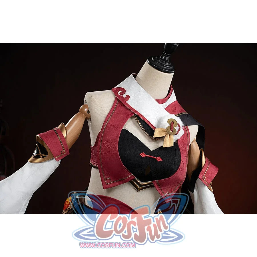 Genshin Impact Yanfei cosplay top detail frames a black bust panel below the red collar and gold ornament.