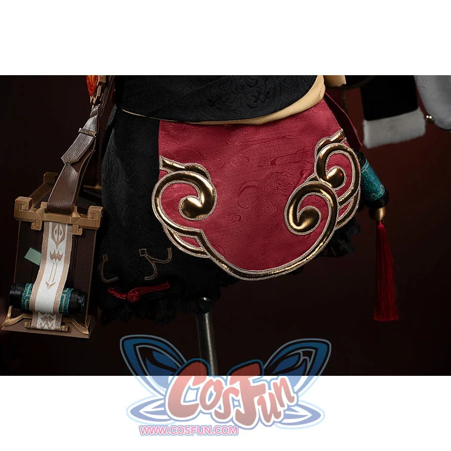 Genshin Impact Yanfei cosplay waist apron close-up centers gold swirls over red jacquard fabric.