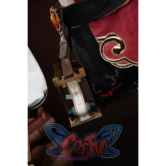 Genshin Impact Yanfei cosplay waist charm detail pairs a framed ornament with red jacquard trim.