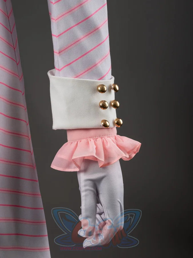 Glinda cosplay blazer cuff close-up with gold-tone buttons above the ruffled pink shirt sleeve