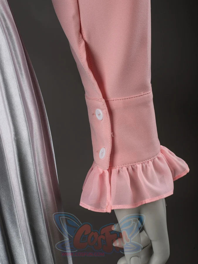 Glinda cosplay blouse cuff close-up with white buttons above a soft pink ruffled sleeve edge