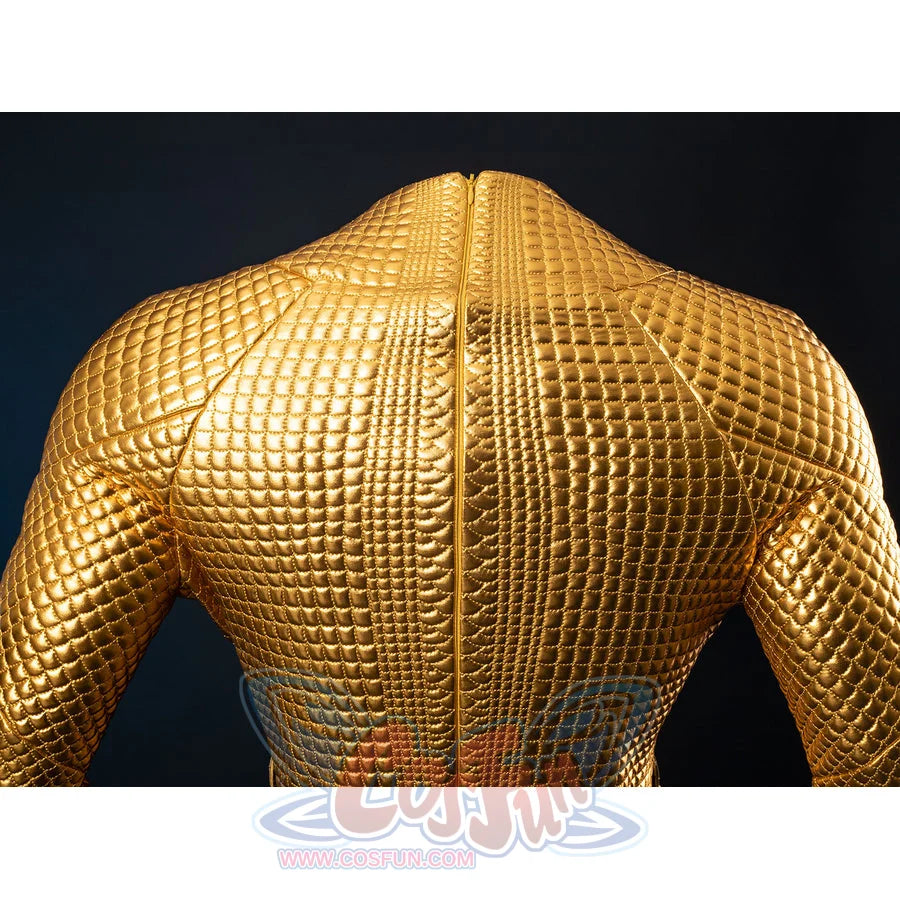 Gold-tone armored cosplay back shoulder close-up traces the center seam through raised scale texture.