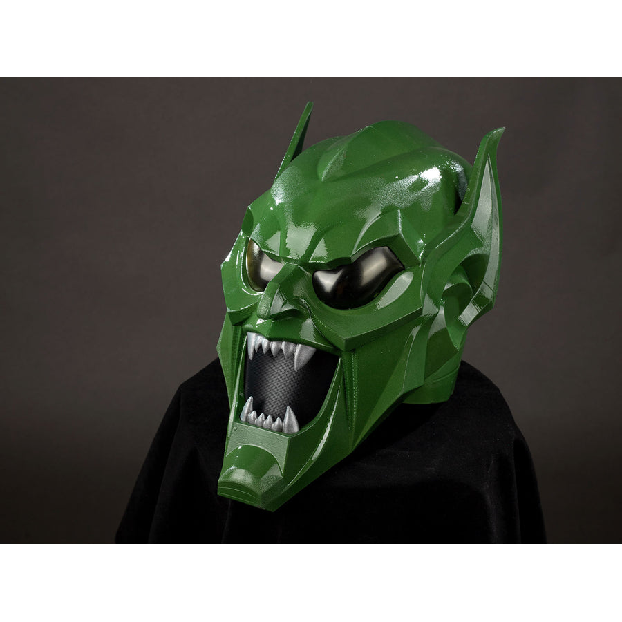 Green Goblin Norman Osborn cosplay helmet angled view layers green cheek plates around dark eye lenses.