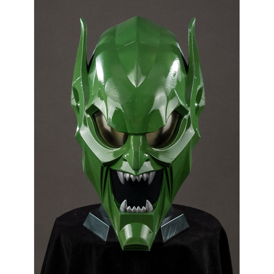 Green Goblin Norman Osborn cosplay helmet front view sets dark eyes below raised green brow ridges.