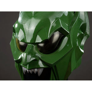 Green Goblin Norman Osborn cosplay helmet eye close-up sets black lenses inside angular green armor.