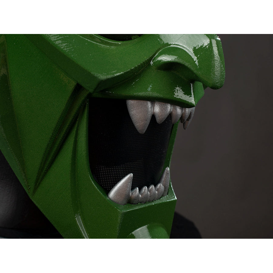Green Goblin Norman Osborn cosplay helmet mouth detail layers sharp teeth around a dark interior.