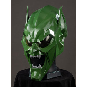 Green Goblin Norman Osborn cosplay helmet three-quarter view angles sharp teeth under glossy green cheek plates.