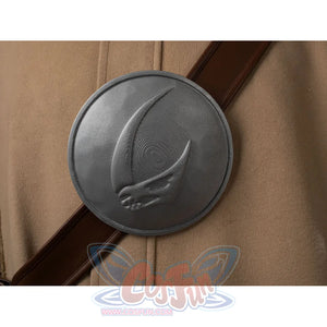 Grogu cosplay costume centers glossy finish badge on brown faux leather crossbody bag strap over woolen robe.