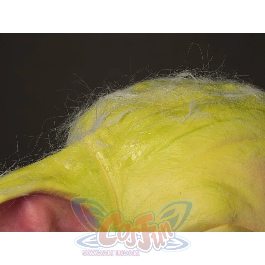 Grogu cosplay headpiece and claws layers fine white hair over the textured bright green latex surface of the mask.