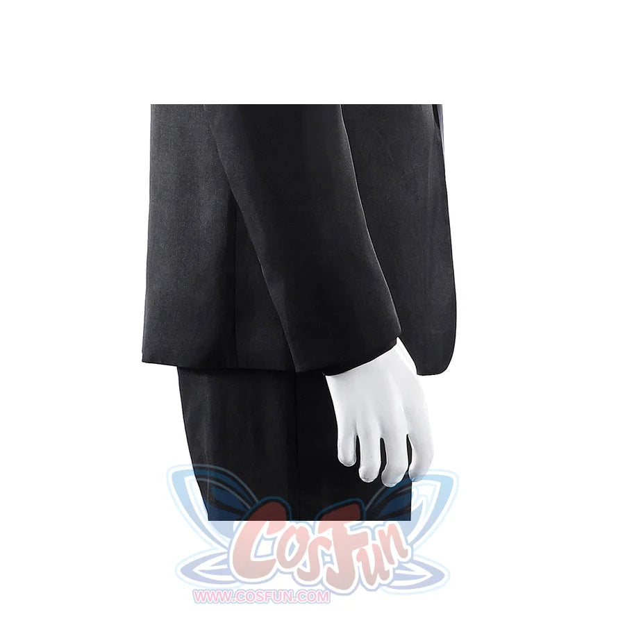 Harvey Dent Two-Face cosplay sleeve detail drops a black cuff beside the matching dark trouser leg.