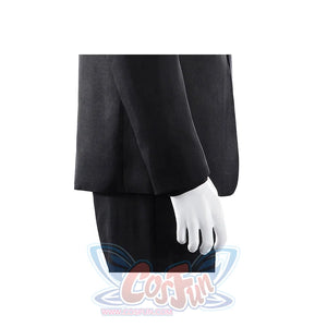 Harvey Dent Two-Face cosplay sleeve detail drops a black cuff beside the matching dark trouser leg.