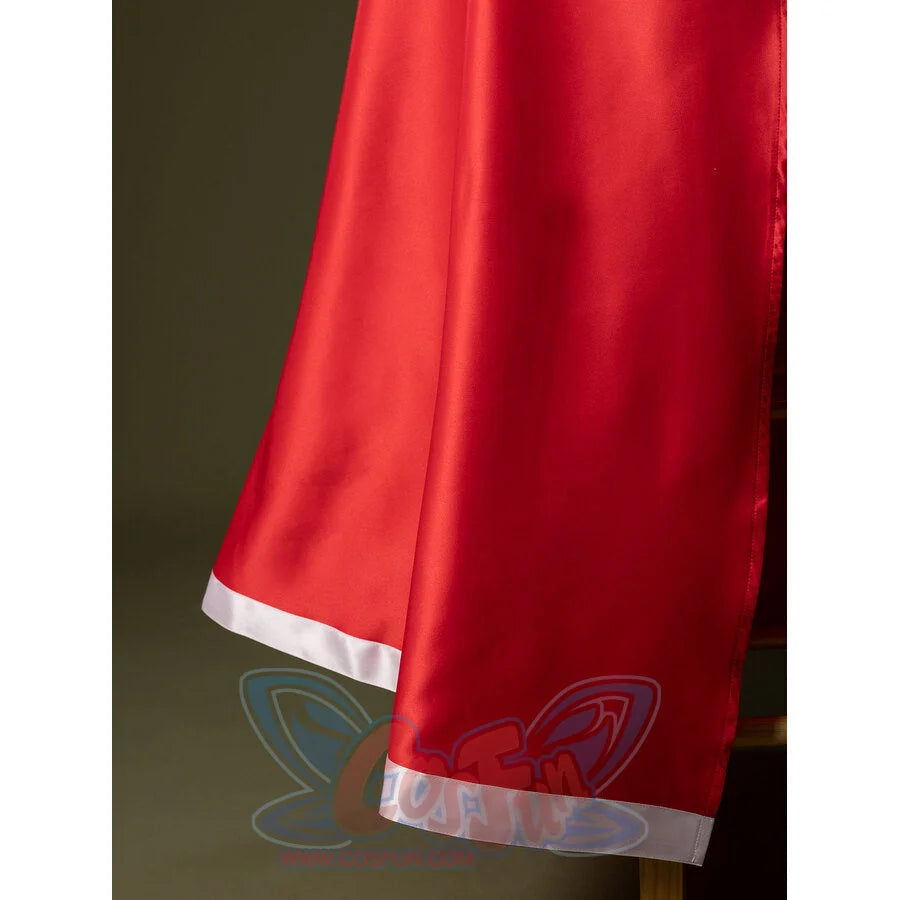 Detail of Charlie Morningstar prom dress skirt hem with red satin fabric, white edge trim and long flowing panel