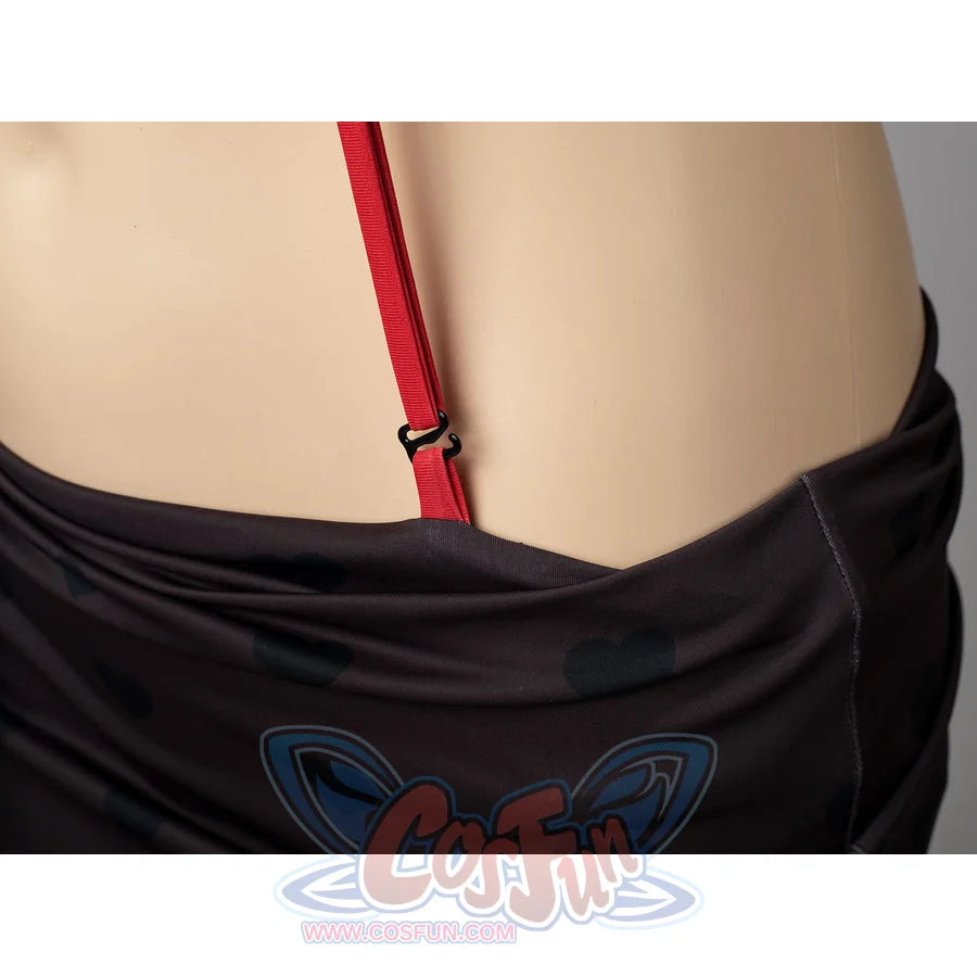 Hazbin Hotel Husk cosplay swimsuit detail anchors a red side strap beside the black skirt wrap.
