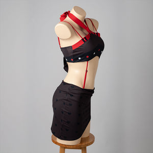 Hazbin Hotel Husk cosplay swimsuit side view arcs red shoulder straps above the black wrapped skirt.