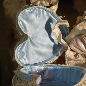 Open heart cake handbag showing blue satin lining and double-head zipper opening