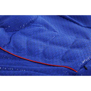 Close-up of Homelander cosplay costume blue fabric from The Boys with embossed texture and red piping