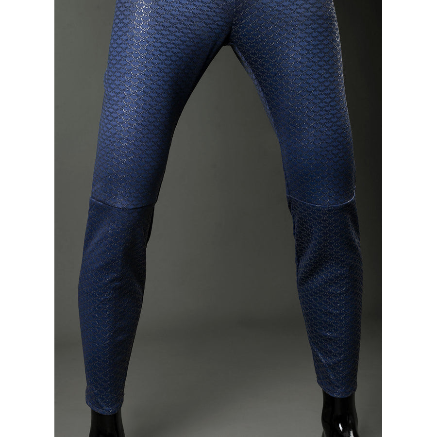 Homelander cosplay costume jumpsuit leg front view follows blue scale texture over fitted knee panels.