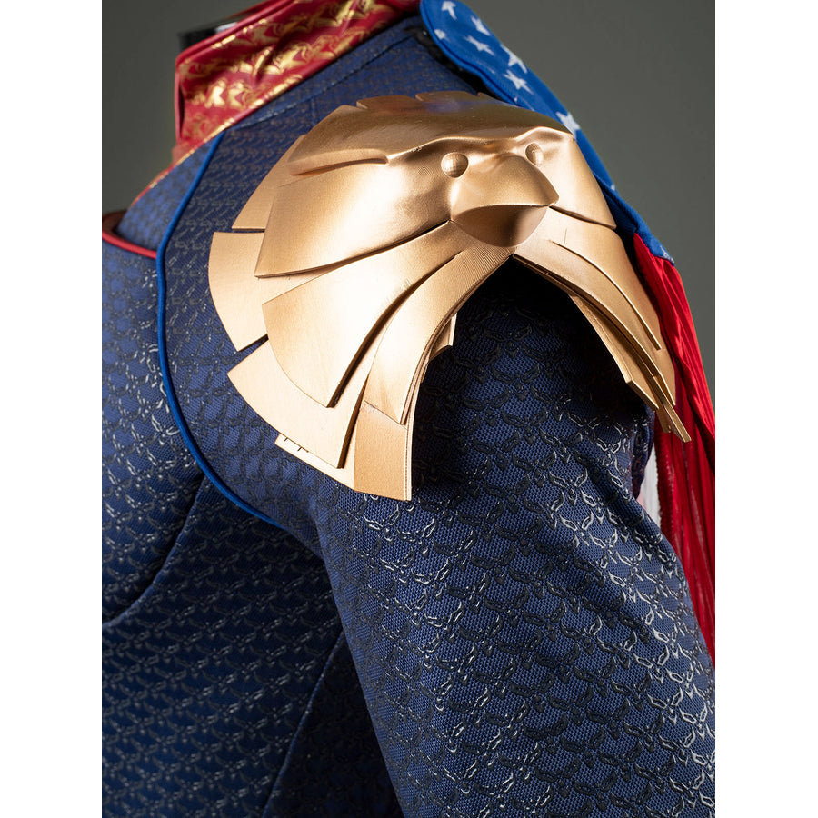 Homelander cosplay costume shoulder armor detail stacks gold-tone plates over the blue sleeve.